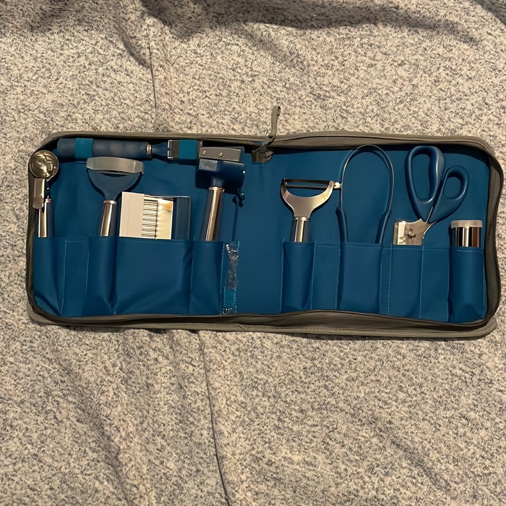 Wolfgang Puck 12 piece garnishing set.  In blue case.  Never used.